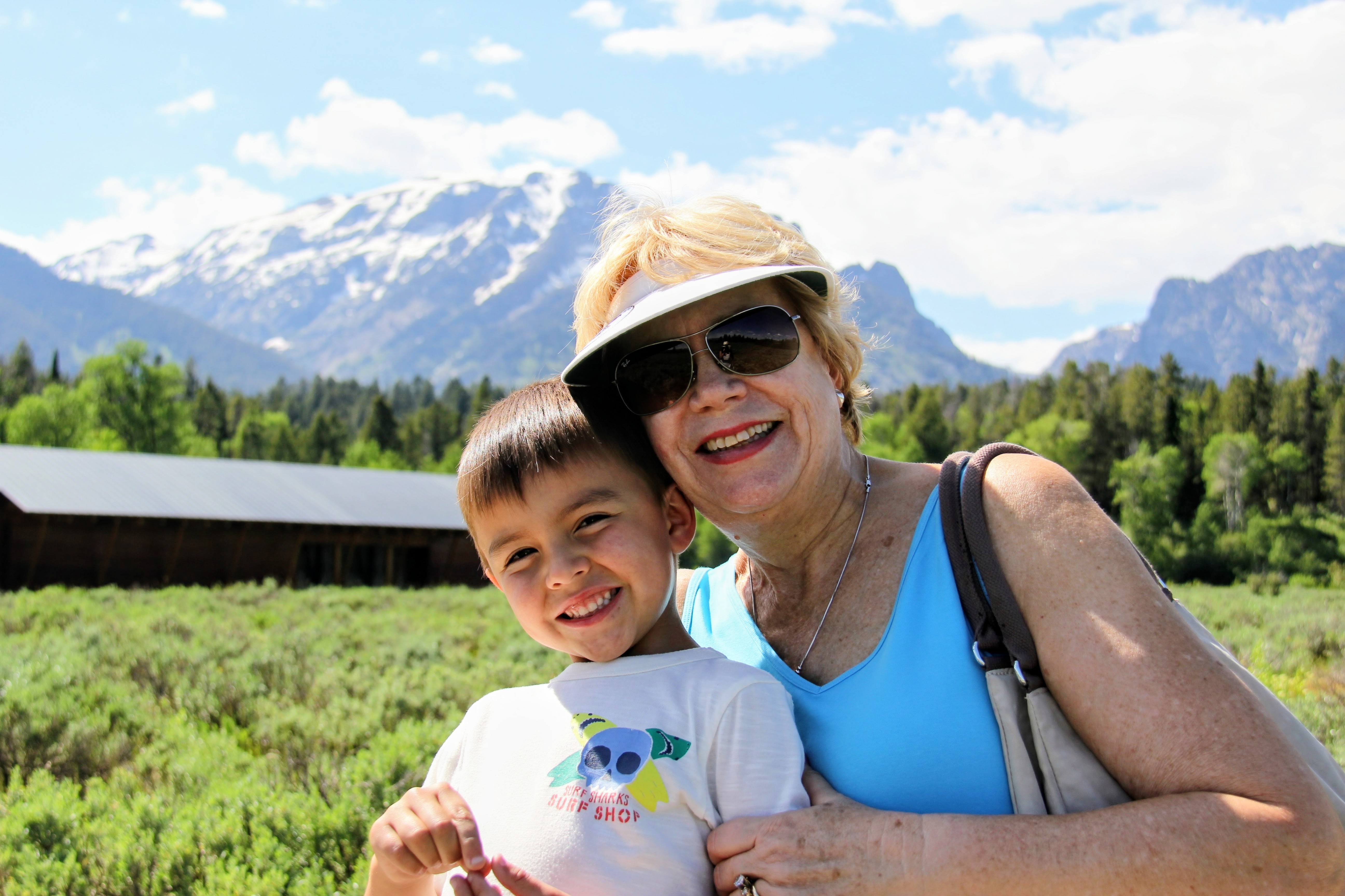 Marsha with grandson in the mountains